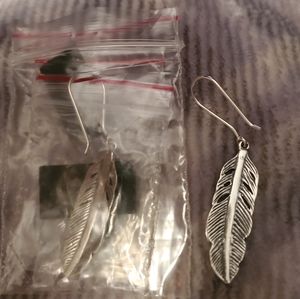 Silpada feather earrings .